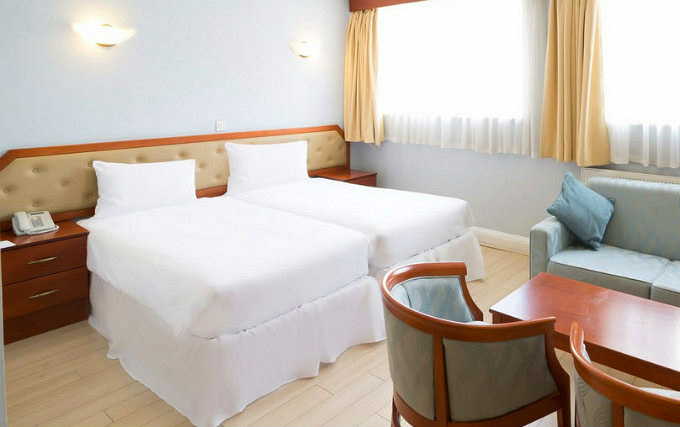 A twin room at Family Hotel