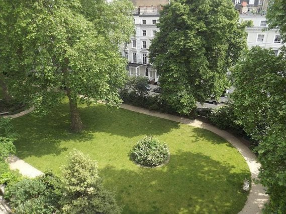 The attractive gardens and exterior of Notting Hill Hostel