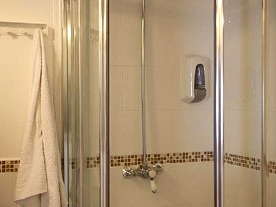 The refurbished bathroom facilities at Hotel 261 are modern and are cleaned daily