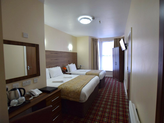 A typical triple room at Lucky 8 Hotel