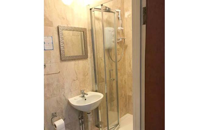 A typical shower system at United Lodge Hotel and Apartments