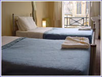 A twin room at the Adamotel