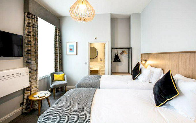 A typical twin room at Wishing Well Inn London