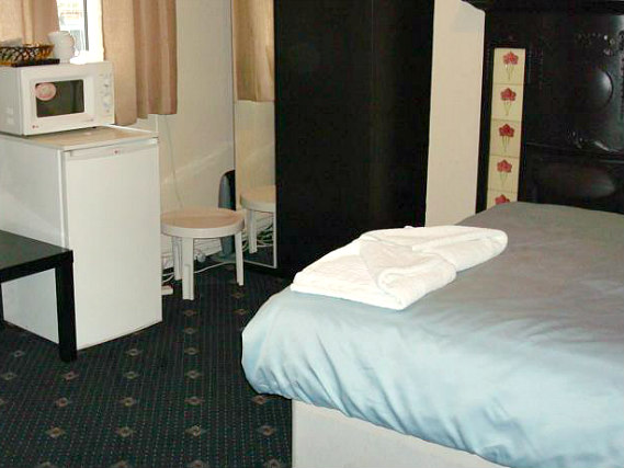 A simply but comfortably furnished double room