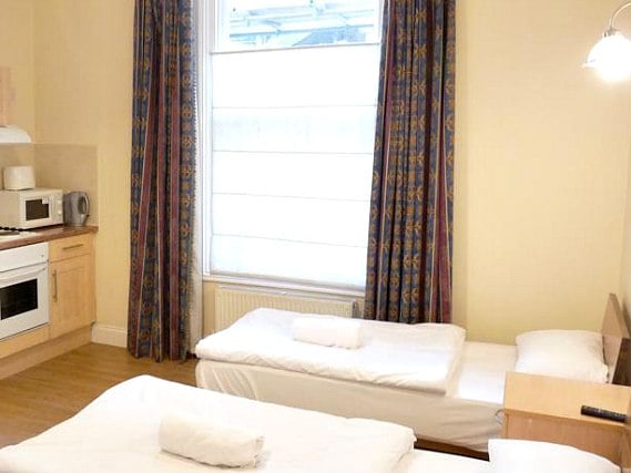 A twin room at Earls Court Studios is perfect for two guests