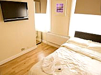 A stylish double room complete with television and kitchenette