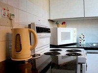 A typical kitchen at Palace Court Holiday Apartments