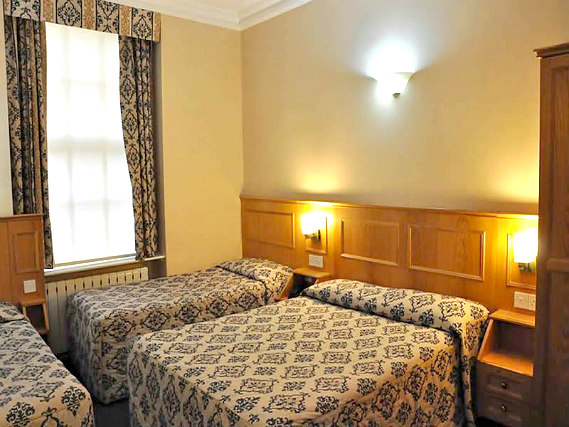 A typical quad room at Olympic House Hotel