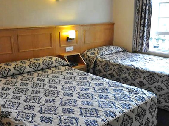 Get a good night's sleep in your comfortable room at Olympic House Hotel