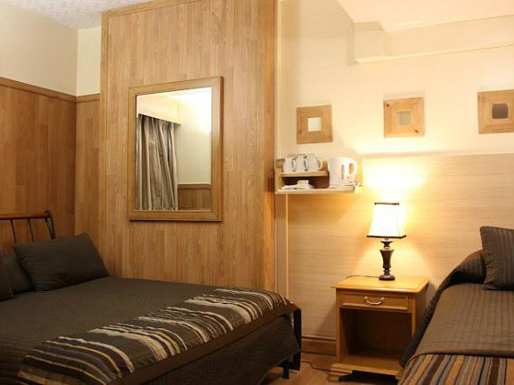 Triple rooms at Oyo Flagship Huttons are the ideal choice for groups of friends or families