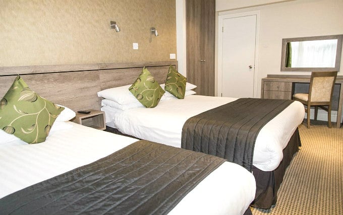 A comfortable triple room at Kensington Garden Hotel
