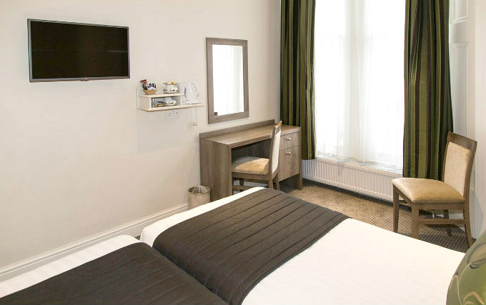 A comfortable twin room at Kensington Garden Hotel