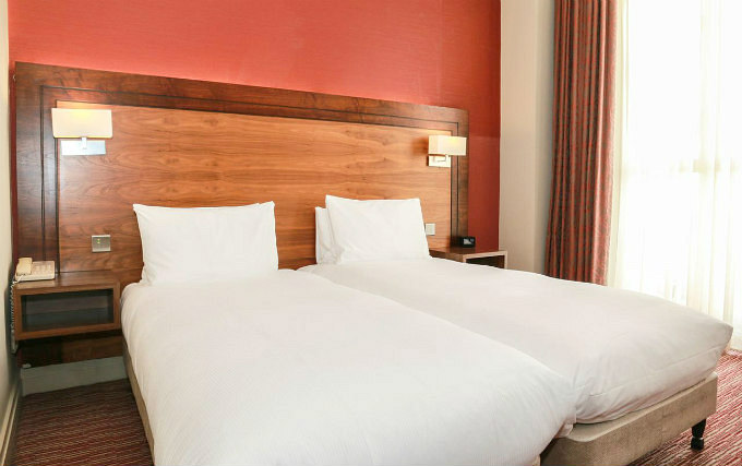 A twin room at 100 Queen's Gate Hotel London Curio Collection by Hilton