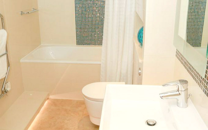 A typical bathroom at 100 Queen's Gate Hotel London Curio Collection by Hilton