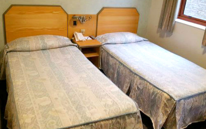 A twin room at Norfolk Plaza Hotel