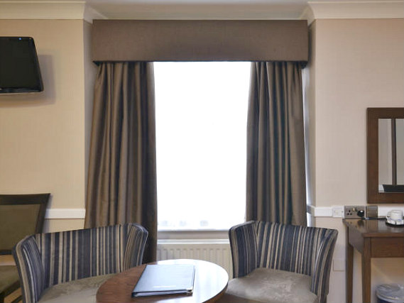 Relax in the lounge at The Princes Square Hotel