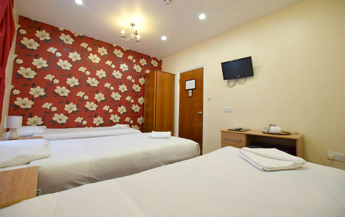 A typical triple room at Express Lodging Studios