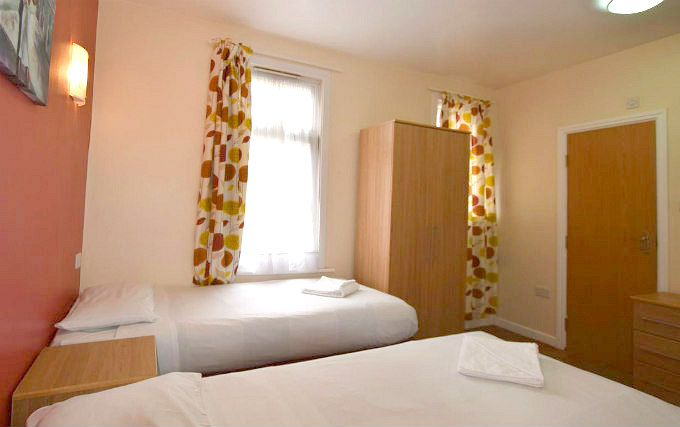 A twin room at Express Lodging Studios