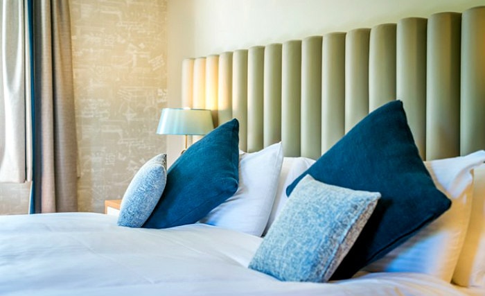 Rest easy in a comfortable bed in your room