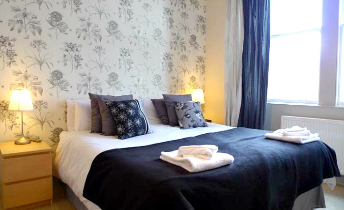 Rest easy in a comfortable bed in your room