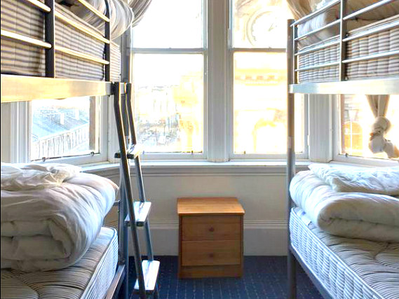 Rest easy in a comfortable bed in your room at City Centre Guesthouse & Hostel