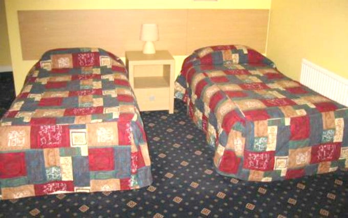 A comfortable twin room at The Langham Hotel