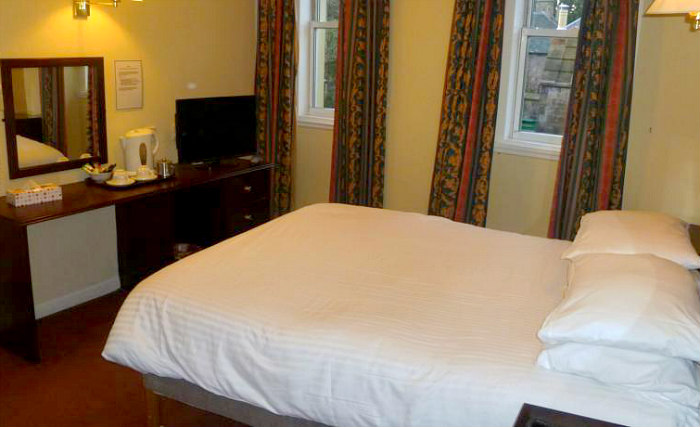 Put your feet up in front of the TV in your room