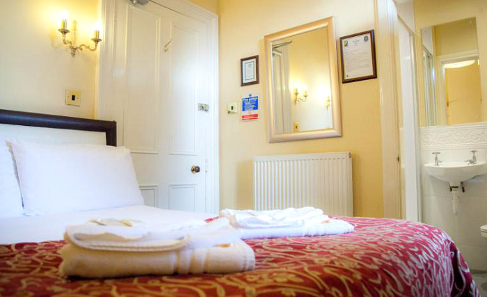 Rest easy in a comfortable bed in your room