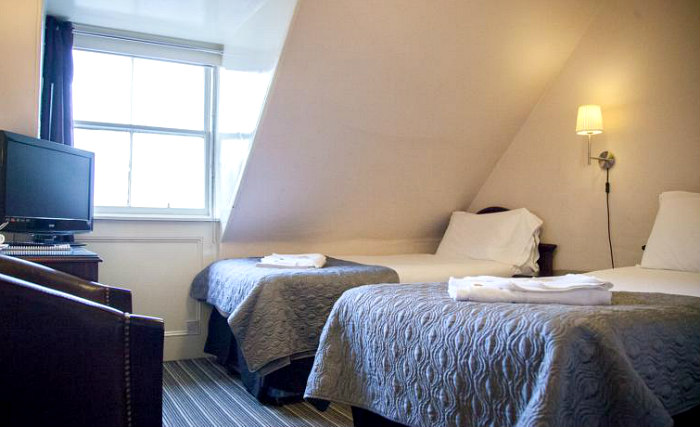 Put your feet up in front of the TV in your room