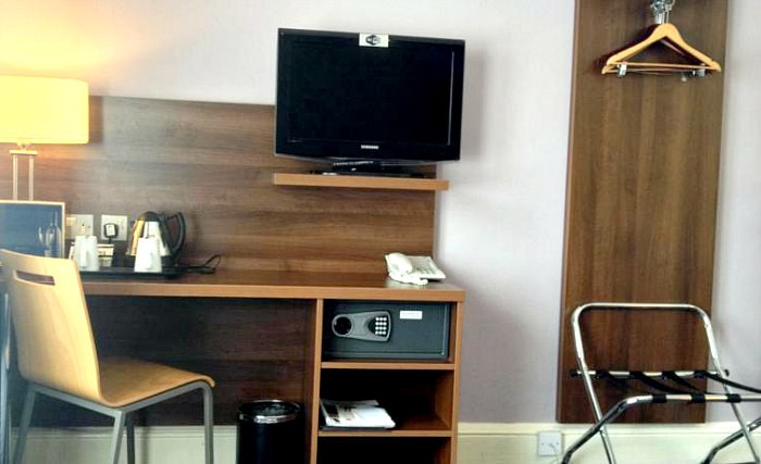 Put your feet up in front of the TV in your room