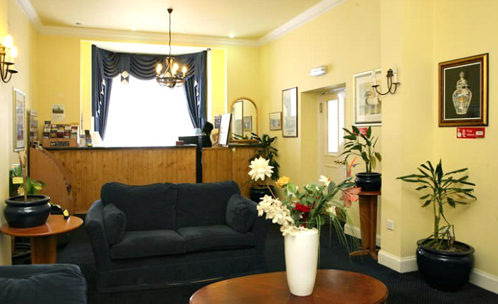 Relax in the lounge at Victorian House Hotel