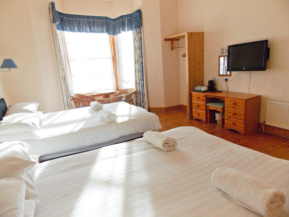 Get a good night's sleep in your comfortable room at Victorian House Hotel