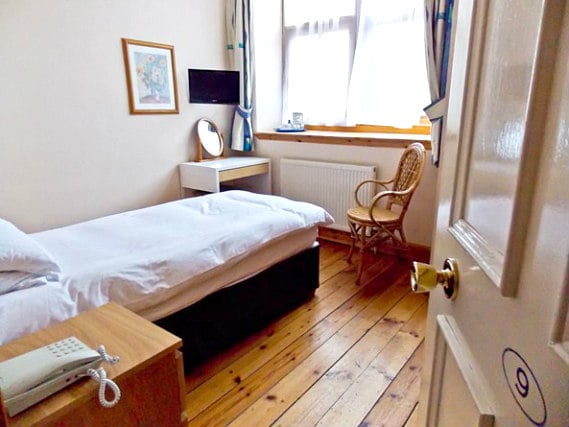 Put your feet up in front of the TV in your room