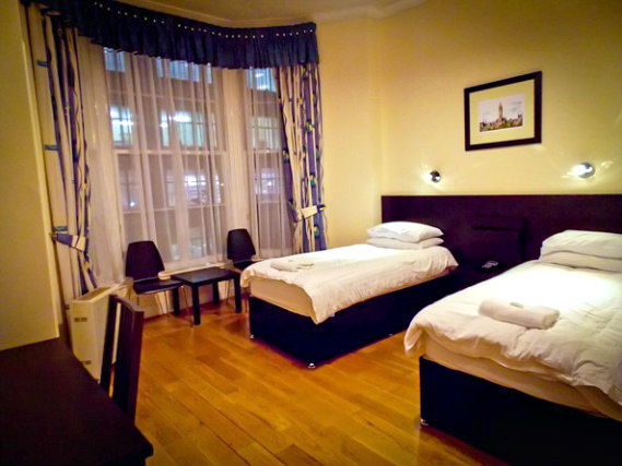 A twin room at Victorian House Hotel is perfect for two guests