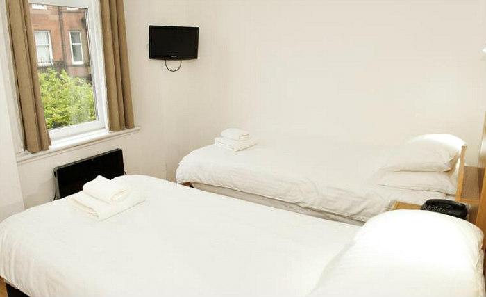 Put your feet up in front of the TV in your room