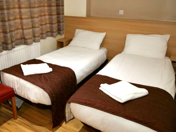 A spacious twin room at Holland Court Hotel