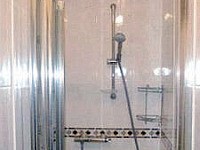 Shower in a typical bathroom at Acropolis Hotel London