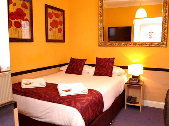 Get a good night's sleep in your comfortable room at Tudor Court Hotel