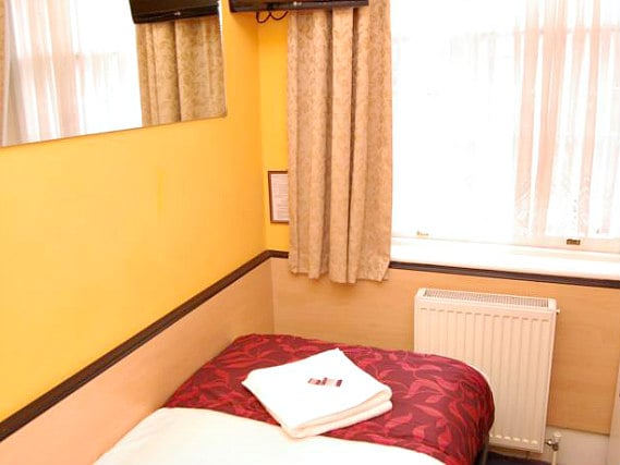 A typical single room at Tudor Court Hotel