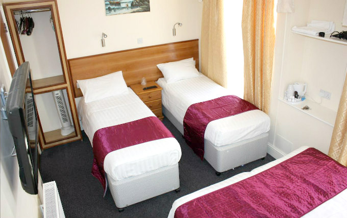 A typical quad room at Apollo Hotel London