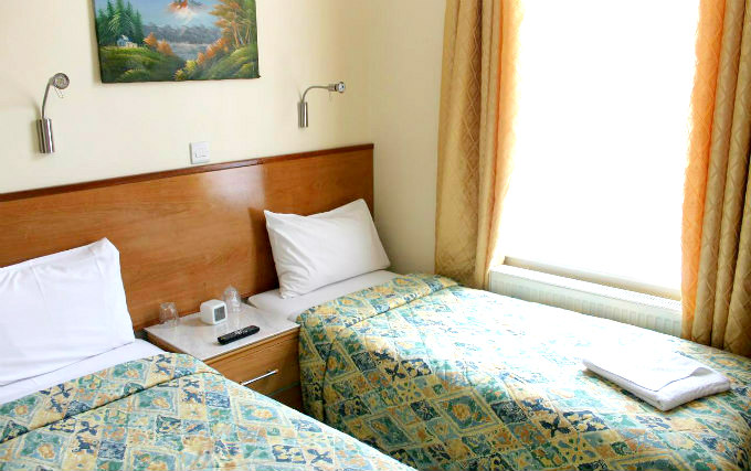 A twin room at Apollo Hotel London