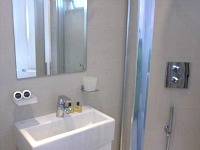 Central Park Studios modern bathroom is cleaned daily and comprises a shower, sink and basin