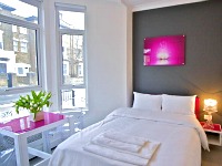 The vibrant pink mixed with white gives a stylish feel to the rooms at Central Park Studios