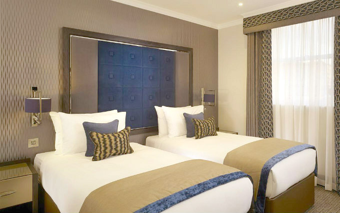 A twin room at Royal Court Apartments