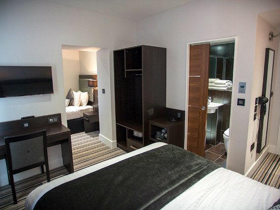 Put your feet up in front of the TV in your room at The W14 Hotel London