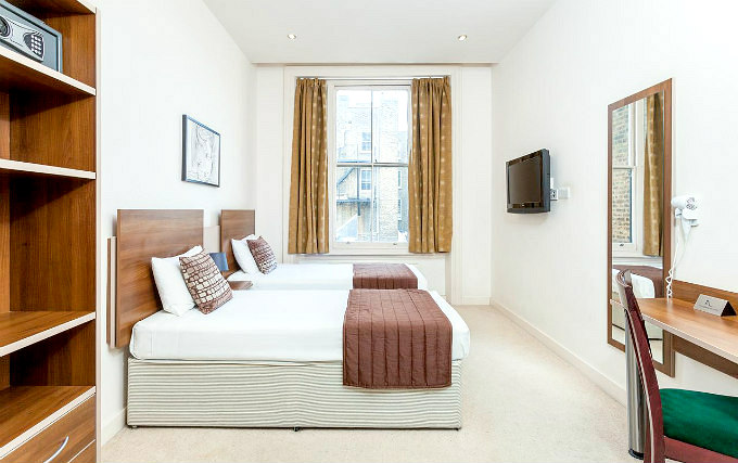 A twin room at Avni Kensington Hotel