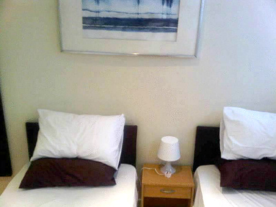 A twin room at Old Friend Hotel is perfect for two guests