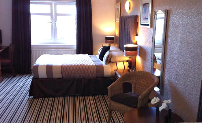 Rest easy in a comfortable bed in your room