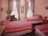 A Triple Room at the Hampton Court Hotel