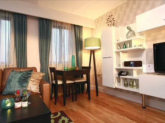 Rest easy in a comfortable bed in your room at Maitrise Suites London Ealing